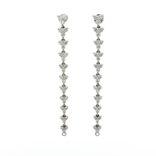 These earrings can be converted into hoops and feature diamonds tot...