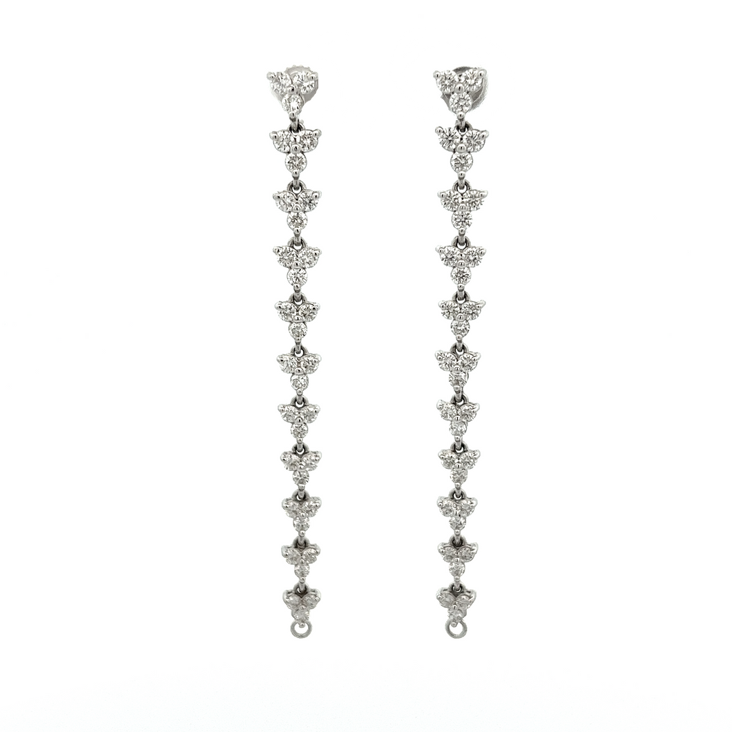 These earrings can be converted into hoops and feature diamonds tot...