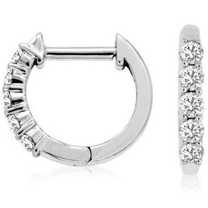 These diamond huggy earrings features .25cts of round brilliant cut...