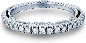 This diamond wedding band by Verragio features pave set round brill...