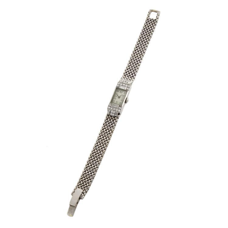 This vintage watch is in platinum and 14k white gold and has 28 rou...