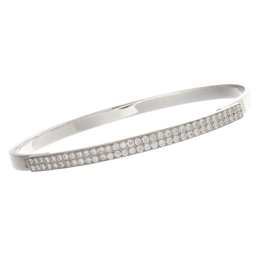 This 18k white gold bracelet features a double row of round brillia...