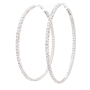 Elegant hoops featuring 140 pave-set diamonds around the inner and ...
