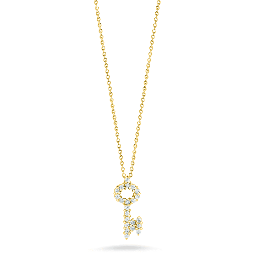 A mini key pendant with diamonds totaling .16ct on an 18