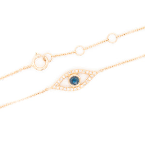 This evil eye bracelet features diamonds and a center sapphire tota...