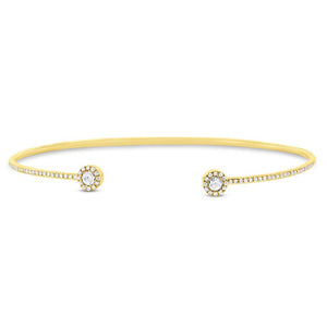 This cuff bracelet features pave set round brilliant cut diamonds a...