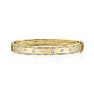 This bangle features round brilliant cut diamonds that total .97cts.
