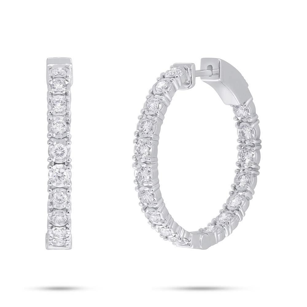 These hoop earrings feature round brilliant cut diamonds that total...