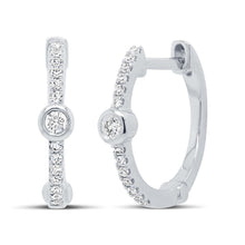 These earrings feature round brilliant cut diamonds that total .13cts.